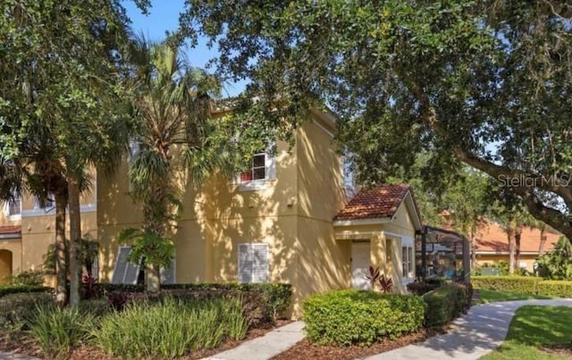 3193 Yellow Lantana Ln, Kissimmee, FL 34747 - view of property exterior with stucco siding