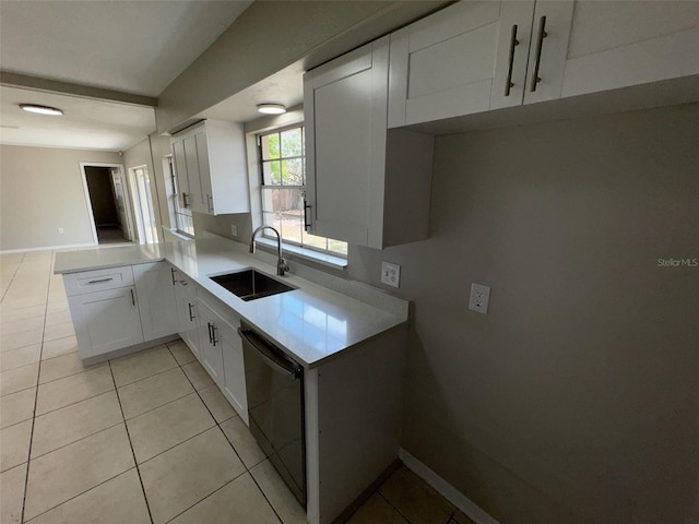 6624 Kristin Ct, Orlando, FL 32818 - kitchen with a sink, dishwasher, white cabinetry, and light countertops