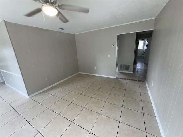 6624 Kristin Ct, Orlando, FL 32818 - unfurnished room with light tile patterned floors, ceiling fan, ornamental molding, and baseboards