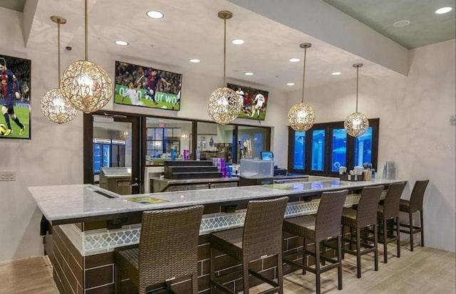 2030 Majorca Dr, Kissimmee, FL 34747 - community bar area featuring light wood-style flooring, recessed lighting, and decorative light fixtures