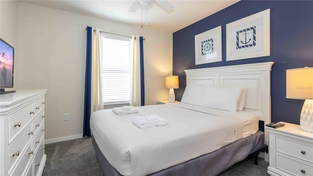 2030 Majorca Dr, Kissimmee, FL 34747 - bedroom featuring dark colored carpet, ceiling fan, and baseboards