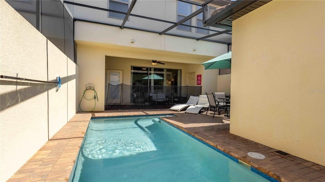 2030 Majorca Dr, Kissimmee, FL 34747 - swimming pool with a ceiling fan, a patio area, and a lanai