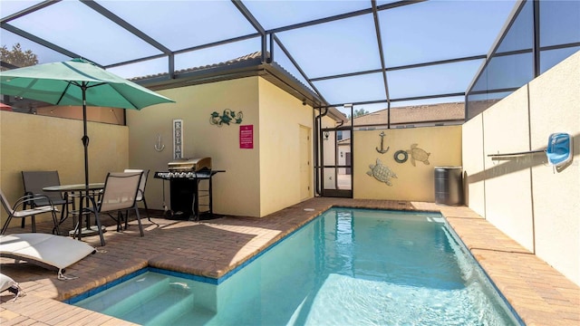 2030 Majorca Dr, Kissimmee, FL 34747 - outdoor pool featuring a patio, glass enclosure, and area for grilling
