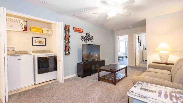 2030 Majorca Dr, Kissimmee, FL 34747 - living area featuring independent washer and dryer, a ceiling fan, light carpet, and baseboards