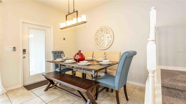 2030 Majorca Dr, Kissimmee, FL 34747 - dining space featuring light tile patterned flooring, baseboards, and a chandelier