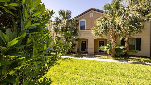 2030 Majorca Dr, Kissimmee, FL 34747 - view of front of property with stucco siding and a front lawn