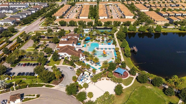 2030 Majorca Dr, Kissimmee, FL 34747 - aerial view of property and surrounding area featuring a pool, a nearby body of water, and nearby suburban area