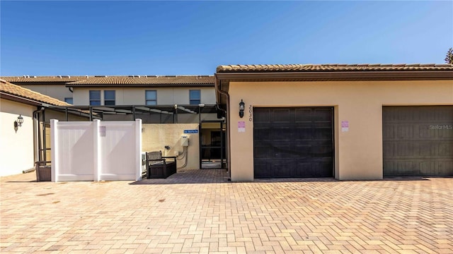 2030 Majorca Dr, Kissimmee, FL 34747 - view of front facade with stucco siding, a tiled roof, and fence