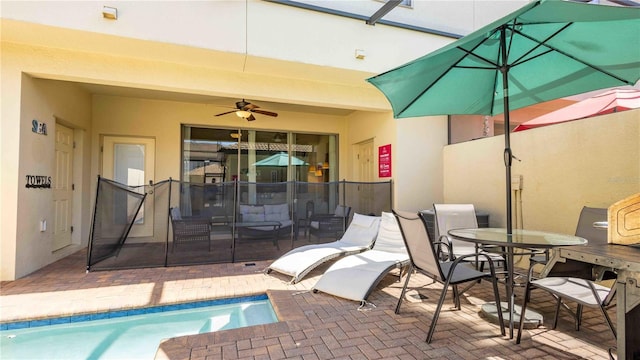 2030 Majorca Dr, Kissimmee, FL 34747 - view of patio / terrace with ceiling fan, outdoor dining space, and an outdoor pool