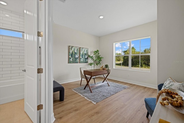 office area with light wood-type flooring, recessed lighting, and baseboards