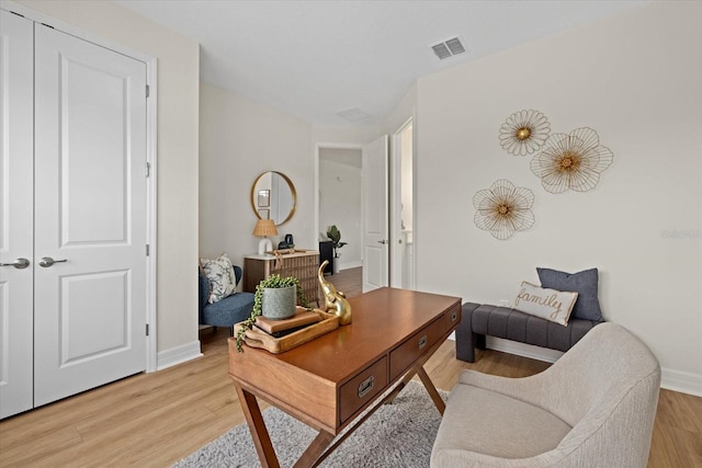 office space featuring light wood finished floors and baseboards