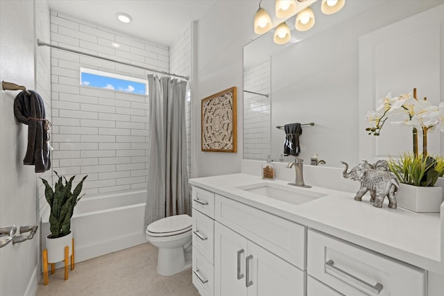 bathroom featuring toilet, vanity, tile patterned floors, and shower / tub combo
