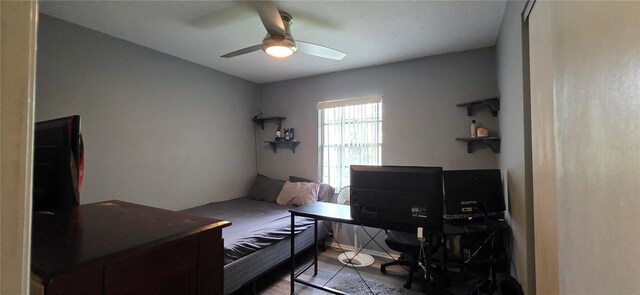 1302 Center St, Ocoee, FL 34761 - bedroom featuring an office area, ceiling fan, and wood finished floors
