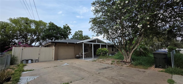 1302 Center St, Ocoee, FL 34761 - single story home with an attached garage, driveway, a gate, and fence