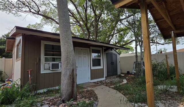 1302 Center St, Ocoee, FL 34761 - view of outbuilding featuring cooling unit, fence, and an outbuilding