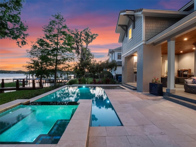 9916 Lone Tree Ln, Orlando, FL 32836 - view of pool with a patio, a water view, and a pool with connected hot tub