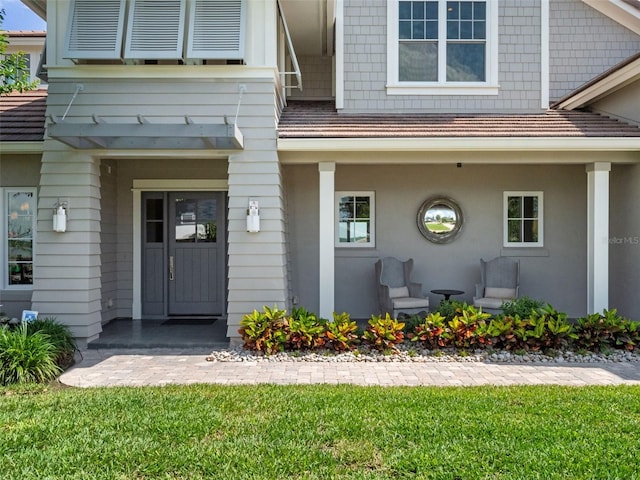 9916 Lone Tree Ln, Orlando, FL 32836 - doorway to property featuring a yard and covered porch