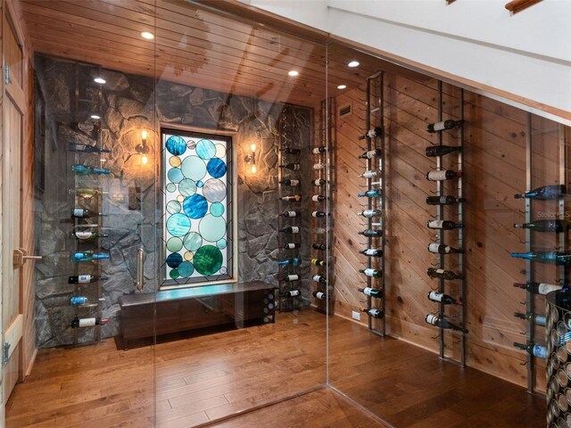 9916 Lone Tree Ln, Orlando, FL 32836 - wine cellar with hardwood / wood-style flooring, wood walls, and recessed lighting