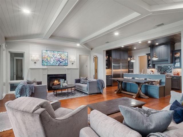 9916 Lone Tree Ln, Orlando, FL 32836 - living area featuring a fireplace, wood finished floors, and recessed lighting