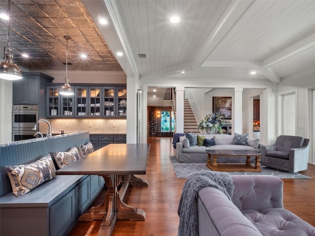 9916 Lone Tree Ln, Orlando, FL 32836 - living area featuring wood finished floors, recessed lighting, stairs, beamed ceiling, and crown molding