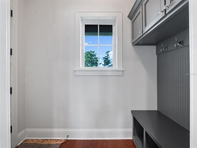 9916 Lone Tree Ln, Orlando, FL 32836 - mudroom featuring baseboards and dark wood-style floors