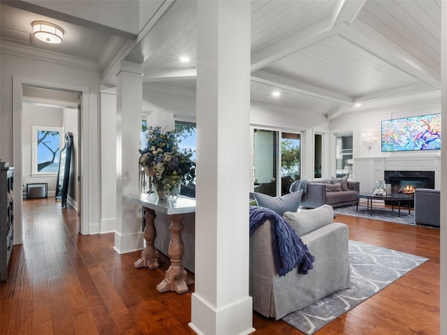 9916 Lone Tree Ln, Orlando, FL 32836 - living area with a fireplace, beam ceiling, recessed lighting, wood finished floors, and baseboards