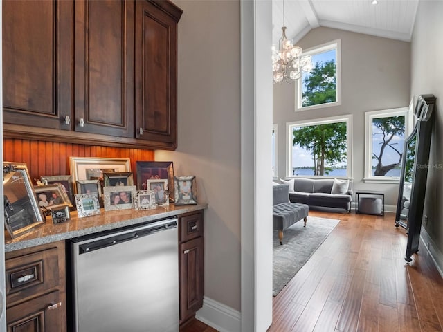 9916 Lone Tree Ln, Orlando, FL 32836 - bar area featuring refrigerator, a chandelier, high vaulted ceiling, wood finished floors, and baseboards