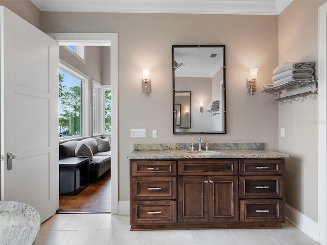 9916 Lone Tree Ln, Orlando, FL 32836 - bathroom with vanity, ornamental molding, baseboards, and tile patterned flooring