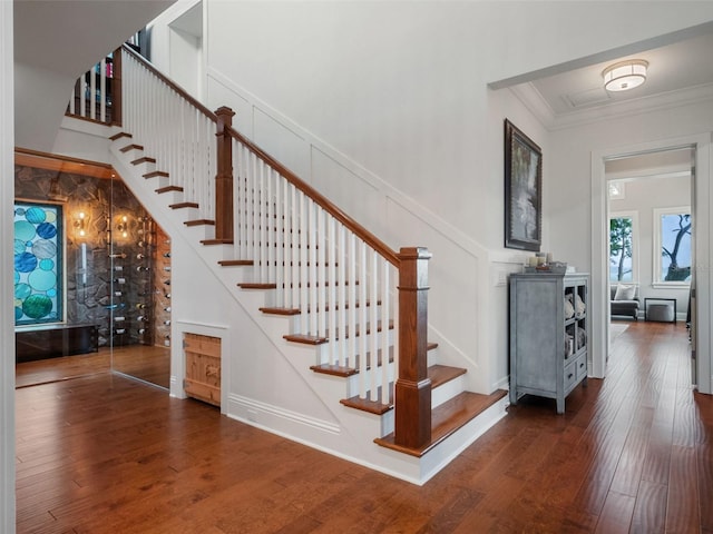 9916 Lone Tree Ln, Orlando, FL 32836 - stairs with a decorative wall, wood finished floors, and ornamental molding