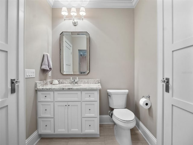 9916 Lone Tree Ln, Orlando, FL 32836 - full bath with baseboards, vanity, ornamental molding, toilet, and wood finished floors