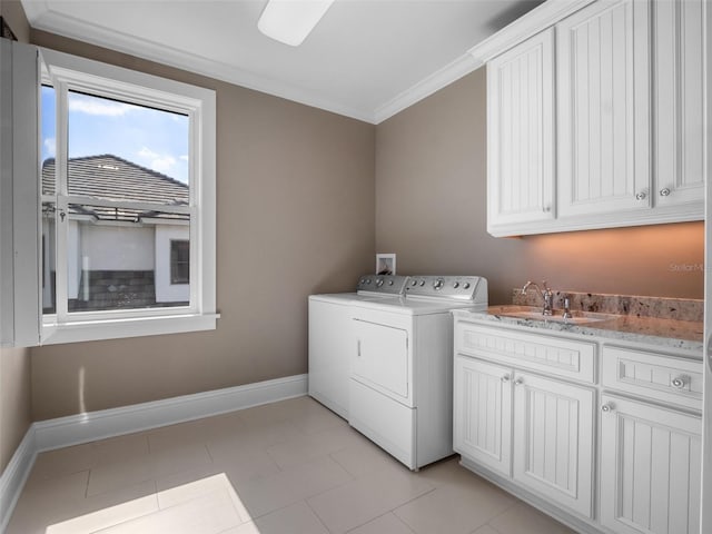 9916 Lone Tree Ln, Orlando, FL 32836 - washroom featuring washing machine and clothes dryer, ornamental molding, cabinet space, and baseboards