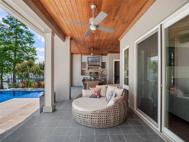9916 Lone Tree Ln, Orlando, FL 32836 - view of patio / terrace with a ceiling fan and an outdoor pool