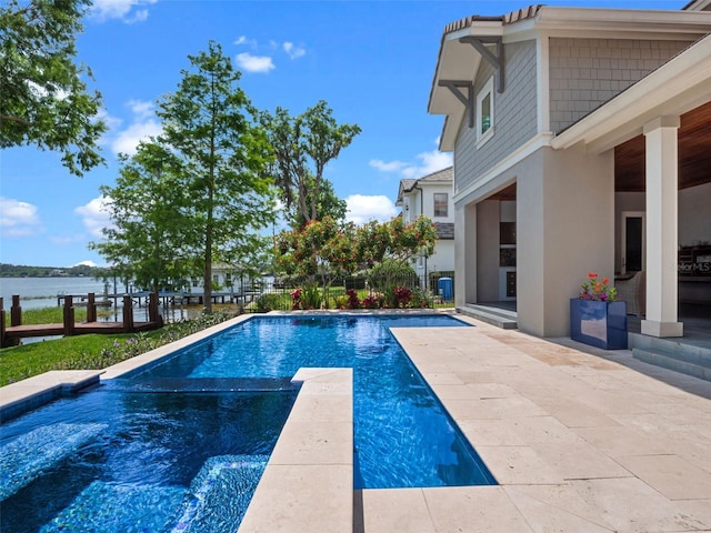 9916 Lone Tree Ln, Orlando, FL 32836 - view of pool with a patio, a pool with connected hot tub, and a water view