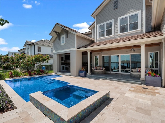 9916 Lone Tree Ln, Orlando, FL 32836 - view of swimming pool with a patio area, a ceiling fan, and a pool with connected hot tub