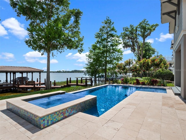 9916 Lone Tree Ln, Orlando, FL 32836 - view of pool featuring a water view, a pool with connected hot tub, and a patio area
