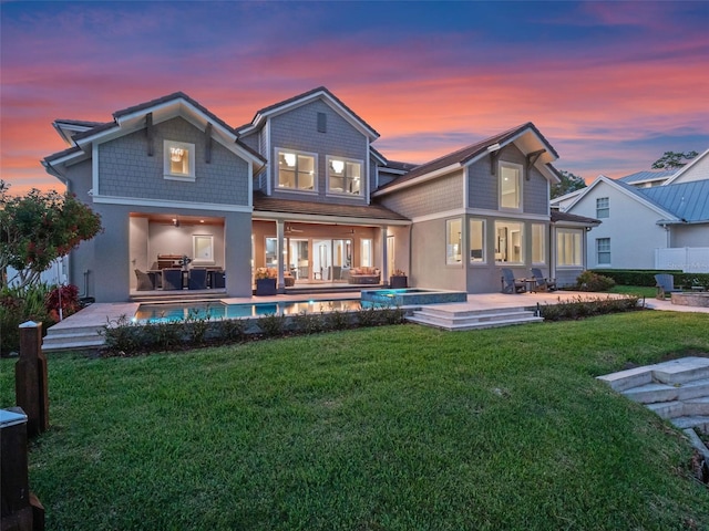 9916 Lone Tree Ln, Orlando, FL 32836 - back of property with an outdoor hangout area, a lawn, a patio, ceiling fan, and a pool with connected hot tub