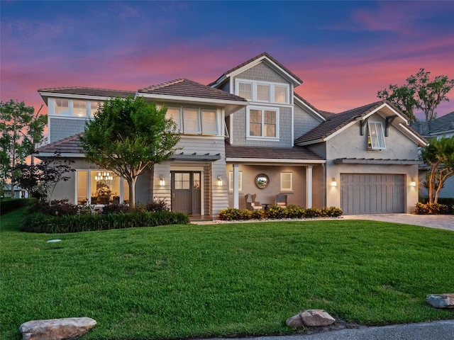 9916 Lone Tree Ln, Orlando, FL 32836 - view of front facade with driveway, a front lawn, stucco siding, and an attached garage