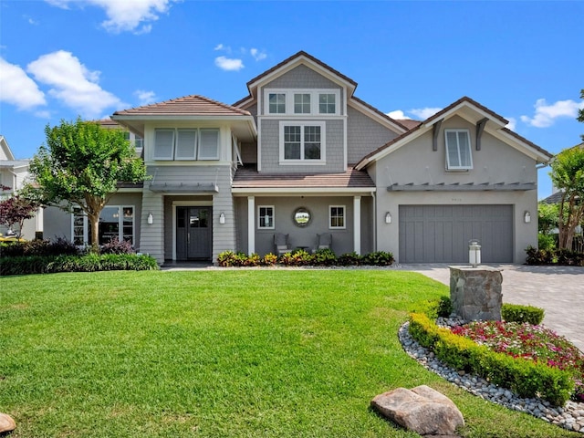 9916 Lone Tree Ln, Orlando, FL 32836 - view of front of home featuring stucco siding, driveway, a garage, and a front yard