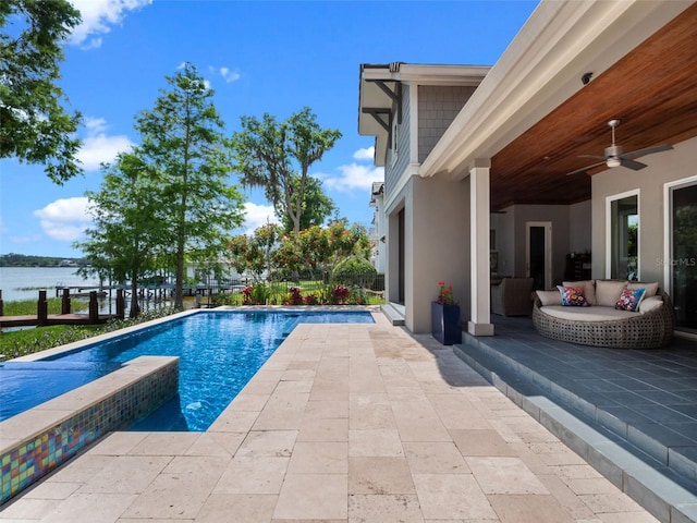 9916 Lone Tree Ln, Orlando, FL 32836 - view of swimming pool with a patio, ceiling fan, a water view, and a pool with connected hot tub