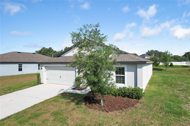 1119 Union Ave, Mascotte, FL 34753 - view of front of property featuring concrete driveway, an attached garage, a front yard, and stucco siding