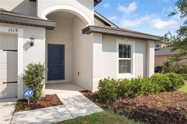 1119 Union Ave, Mascotte, FL 34753 - view of exterior entry with stucco siding