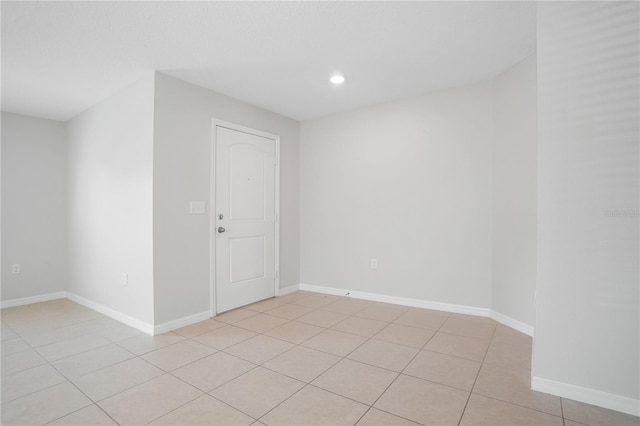 1119 Union Ave, Mascotte, FL 34753 - spare room featuring light tile patterned floors, baseboards, and recessed lighting