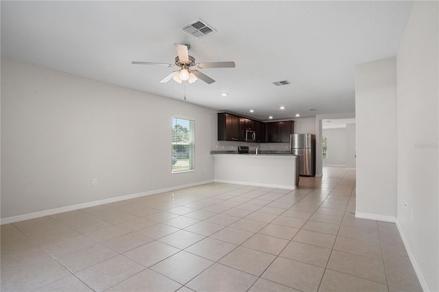 1119 Union Ave, Mascotte, FL 34753 - unfurnished living room featuring a ceiling fan, light tile patterned floors, recessed lighting, and baseboards