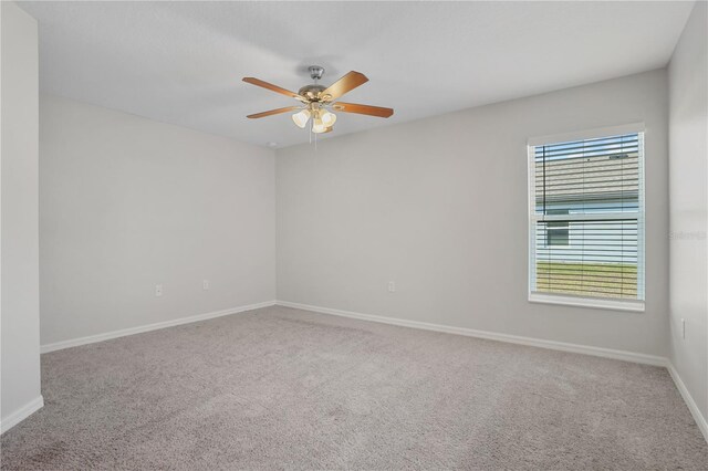 1119 Union Ave, Mascotte, FL 34753 - spare room with carpet floors, ceiling fan, and baseboards