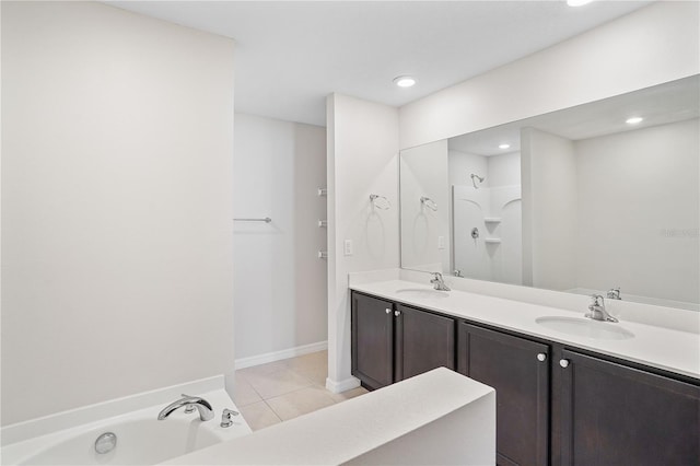 1119 Union Ave, Mascotte, FL 34753 - bathroom featuring a tub, double vanity, tile patterned floors, recessed lighting, and a shower