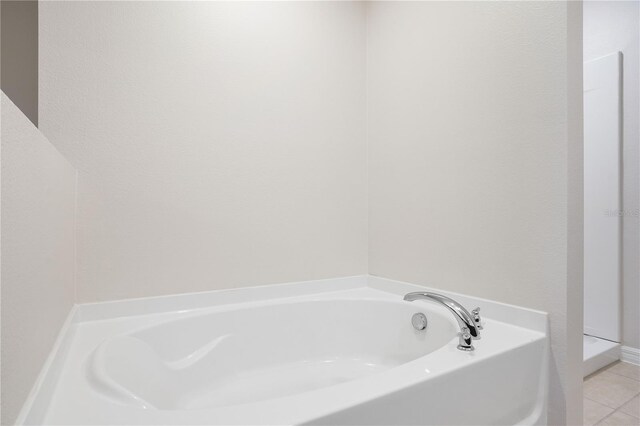 1119 Union Ave, Mascotte, FL 34753 - full bath with a bath and tile patterned floors