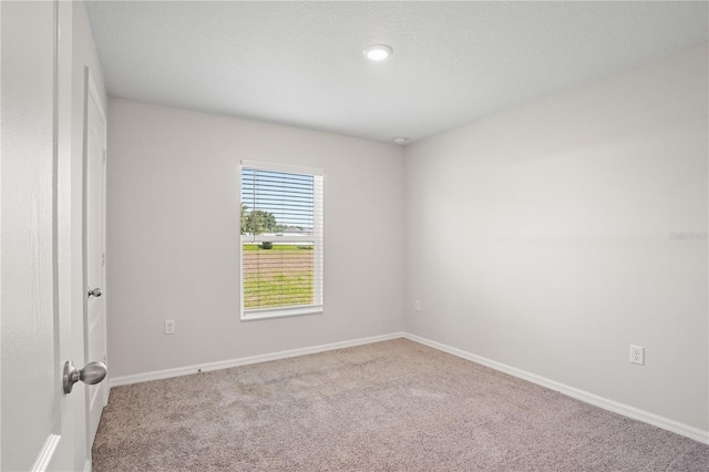 1119 Union Ave, Mascotte, FL 34753 - empty room with carpet floors and baseboards
