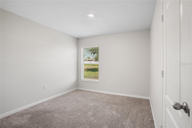 1119 Union Ave, Mascotte, FL 34753 - unfurnished room with carpet flooring and baseboards