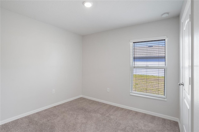 1119 Union Ave, Mascotte, FL 34753 - unfurnished room featuring carpet, a smoke detector, and baseboards