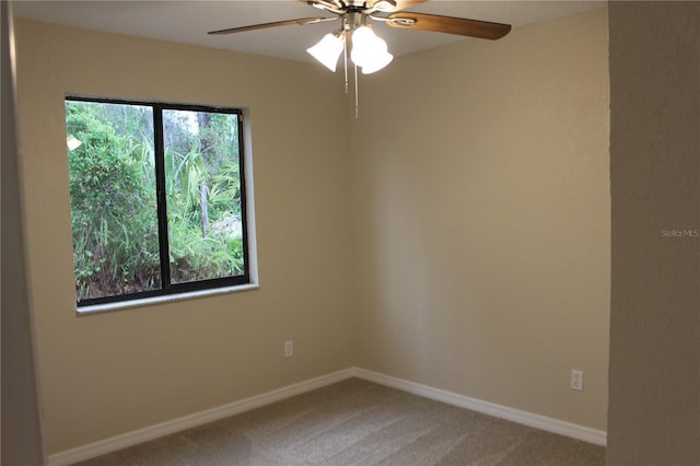 unfurnished room featuring ceiling fan, carpet floors, and baseboards